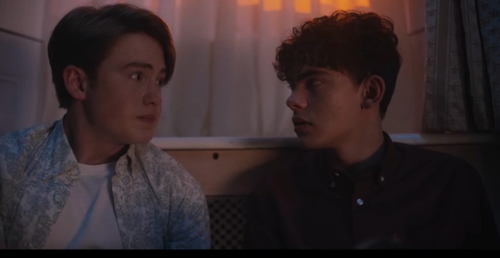 Nick and Charlie from the Netflix show "Heartstopper" look at each other